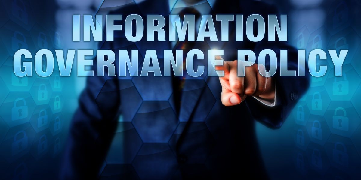 IT manager is pushing INFORMATION GOVERNANCE POLICY on a touch screen interface. Business strategy metaphor and information technology concept for IG practices aimed at improving compliance.